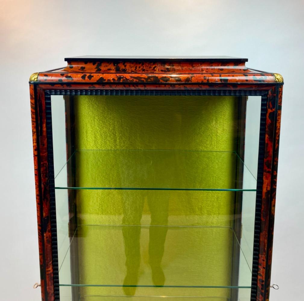 A tortoise shell vitrine by Maison Franck. 