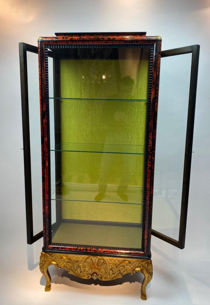 A tortoise shell vitrine by Maison Franck. 