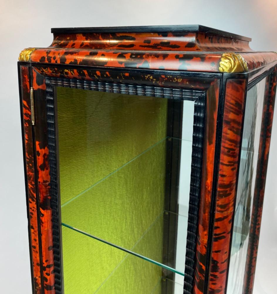 A tortoise shell vitrine by Maison Franck. 