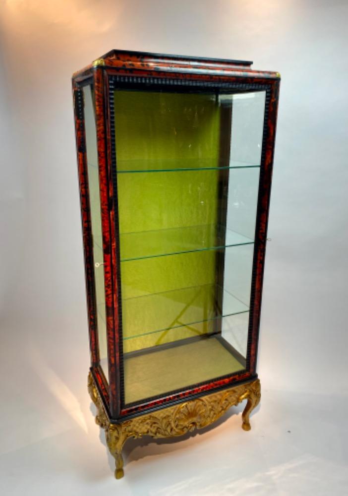 A tortoise shell vitrine by Maison Franck. 