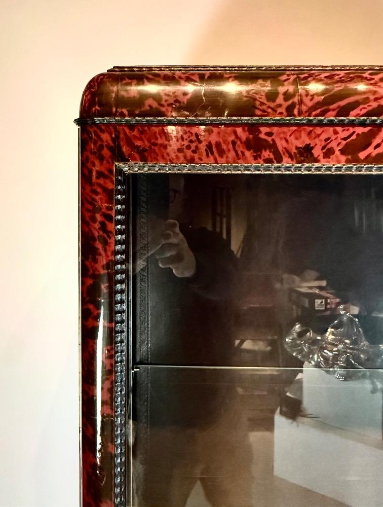 A tortoise shell Vitrine by Maison Franck