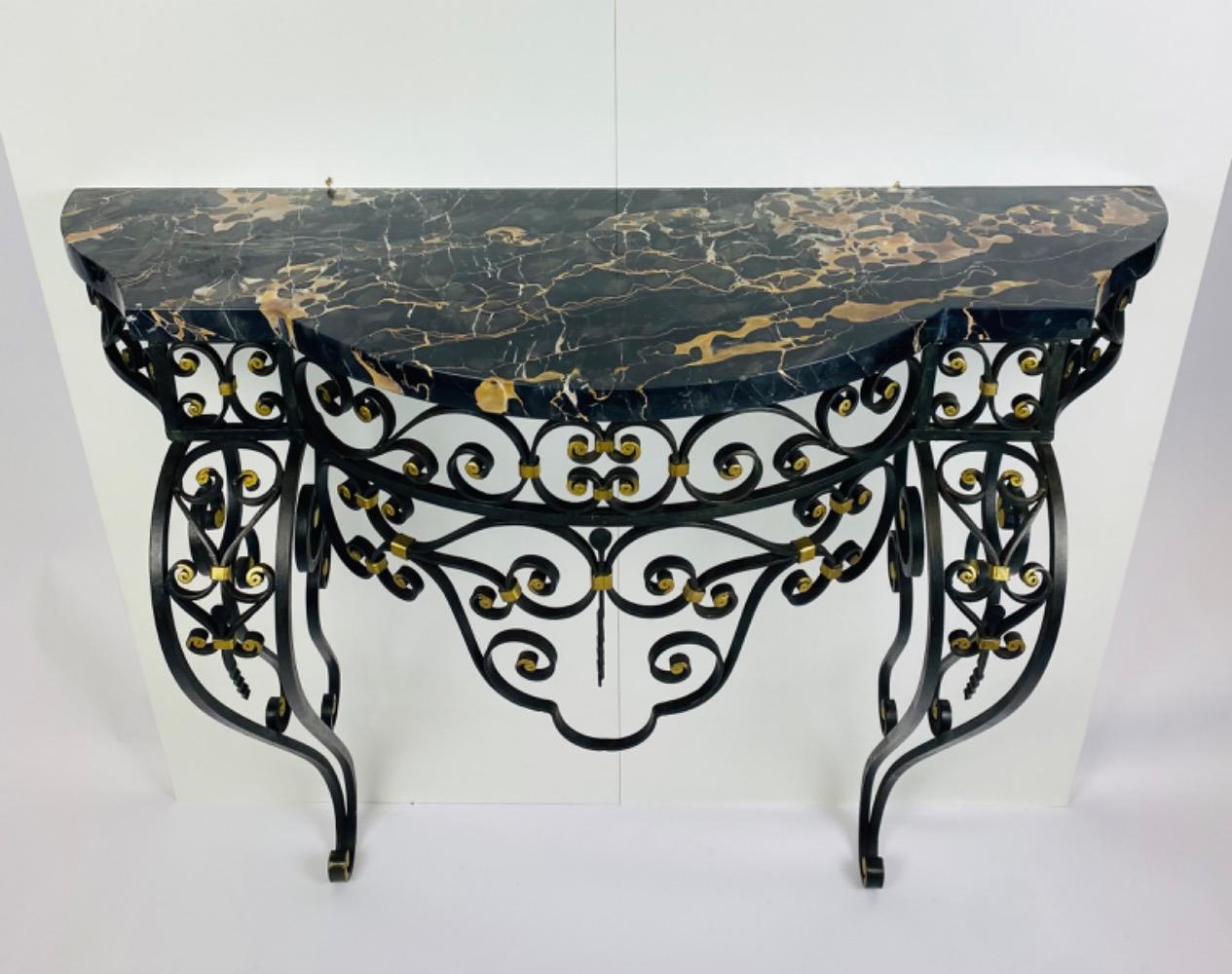 An Art Deco iron console