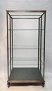 An early 20thC. iron display cabinet. 