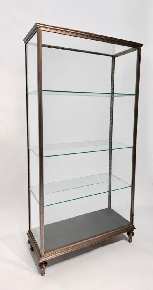 An early 20thC. iron display cabinet. 