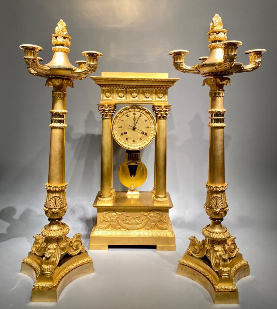 An exceptional ormolu Charles X clock garniture set. 