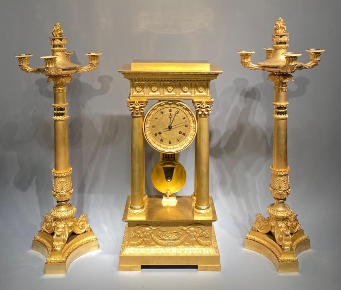 An exceptional ormolu Charles X clock garniture set. 