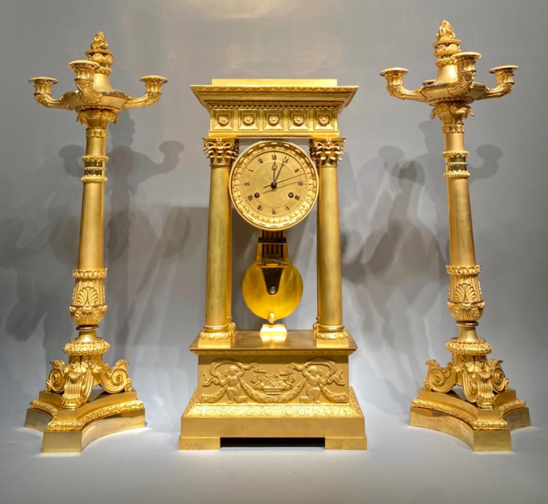 An exceptional ormolu Charles X clock garniture set. 