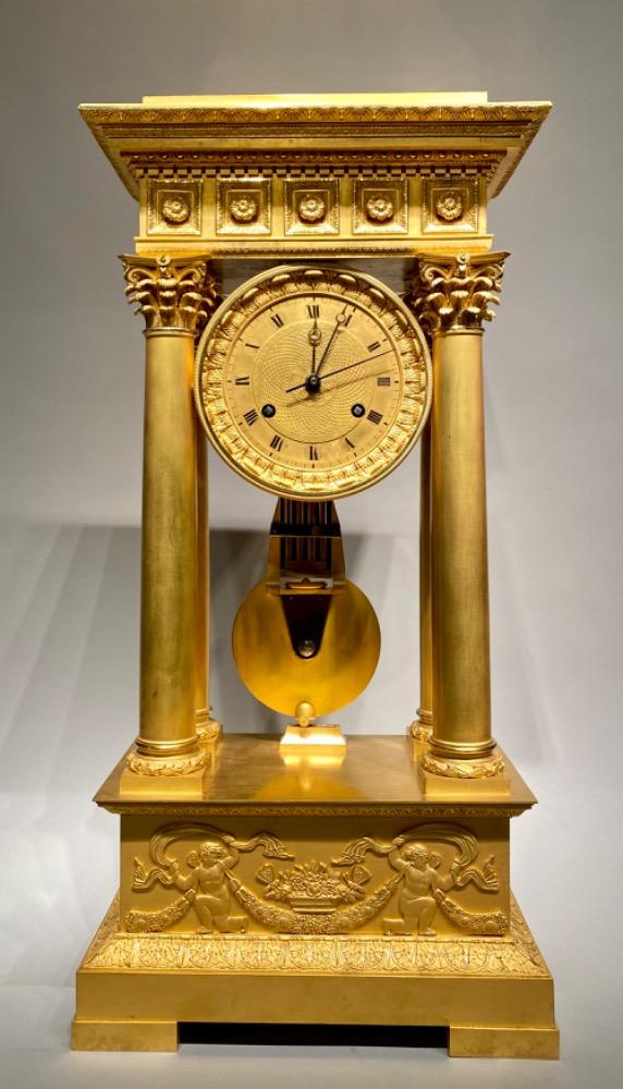 An exceptional ormolu Charles X clock garniture set. 