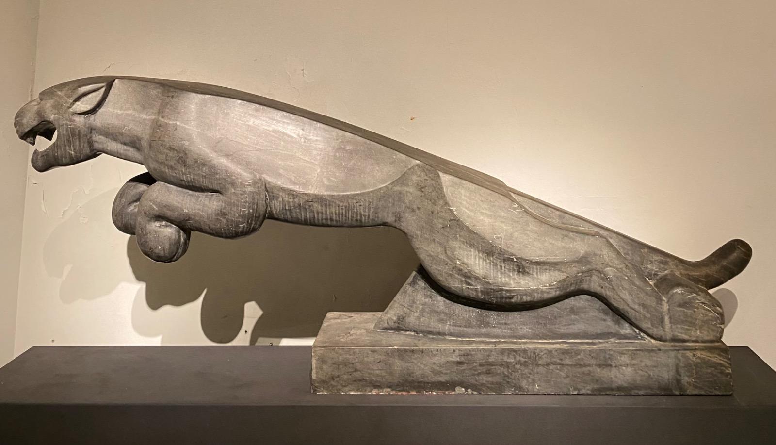 An impressive mid 20thC. life size Art Deco stone Jaguar.