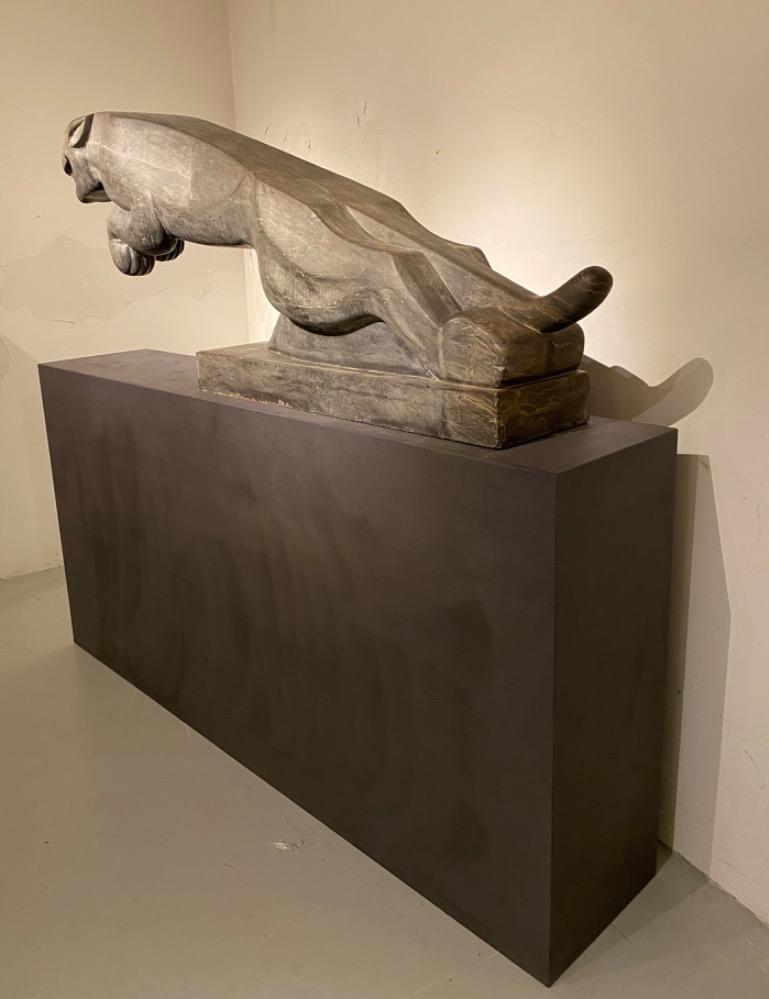 An impressive mid 20thC. life size Art Deco stone Jaguar.