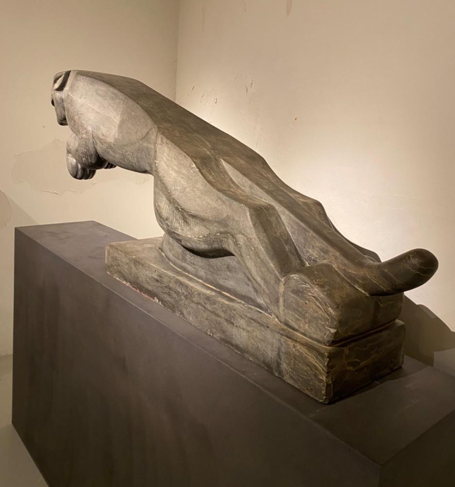 An impressive mid 20thC. life size Art Deco stone Jaguar.