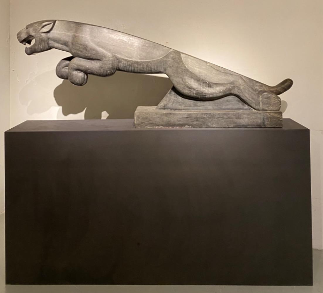 An impressive mid 20thC. life size Art Deco stone Jaguar.