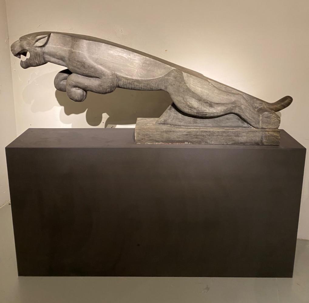 An impressive mid 20thC. life size Art Deco stone Jaguar.