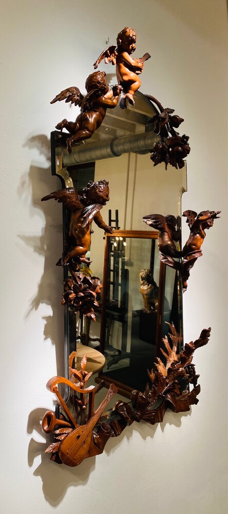 Black forest Carved walnut mirror. 