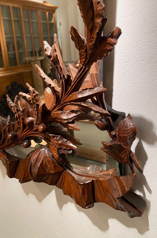 Black forest Carved walnut mirror. 