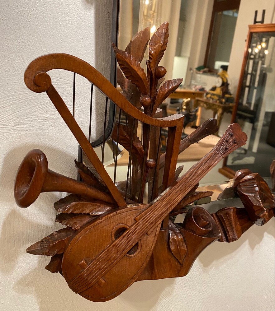 Black forest Carved walnut mirror. 