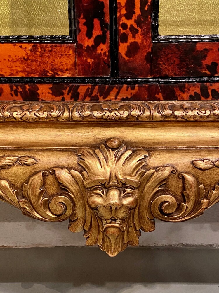 Exceptional pair of Louis XV style red tortoiseshell vitrines.