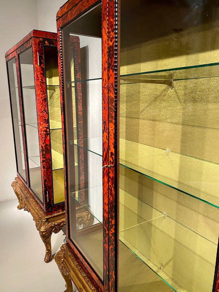 Exceptional pair of Louis XV style red tortoiseshell vitrines.