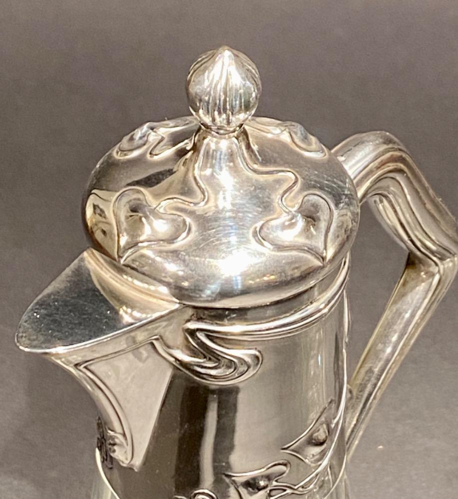 Pair of Art Nouveau silver decanters. 