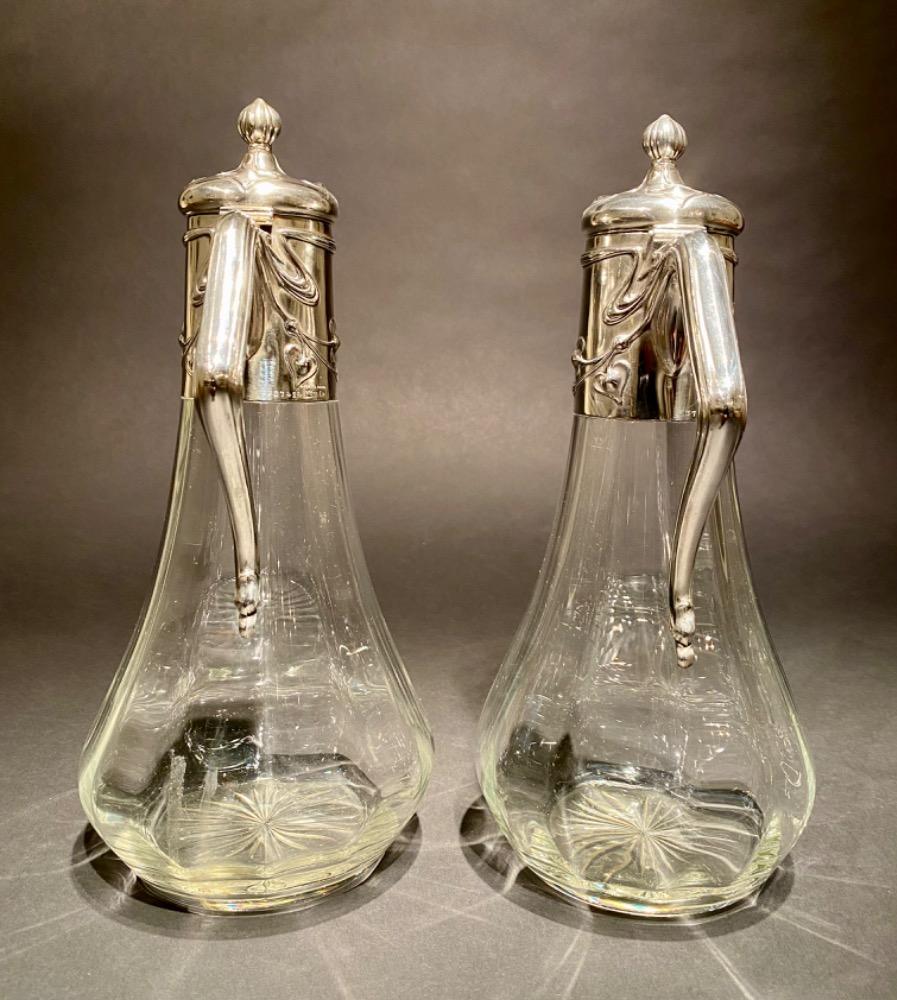 Pair of Art Nouveau silver decanters. 