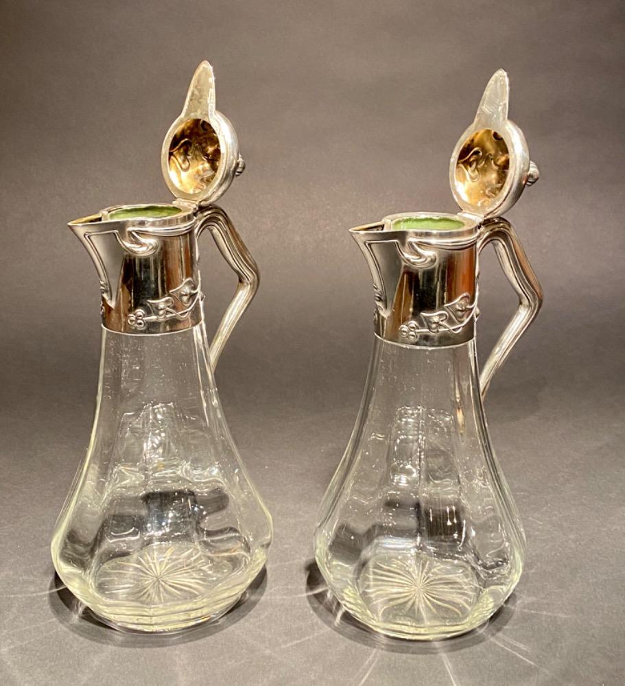 Pair of Art Nouveau silver decanters. 