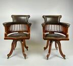 Pair Victorian mahogany & leather revolving desk chairs.